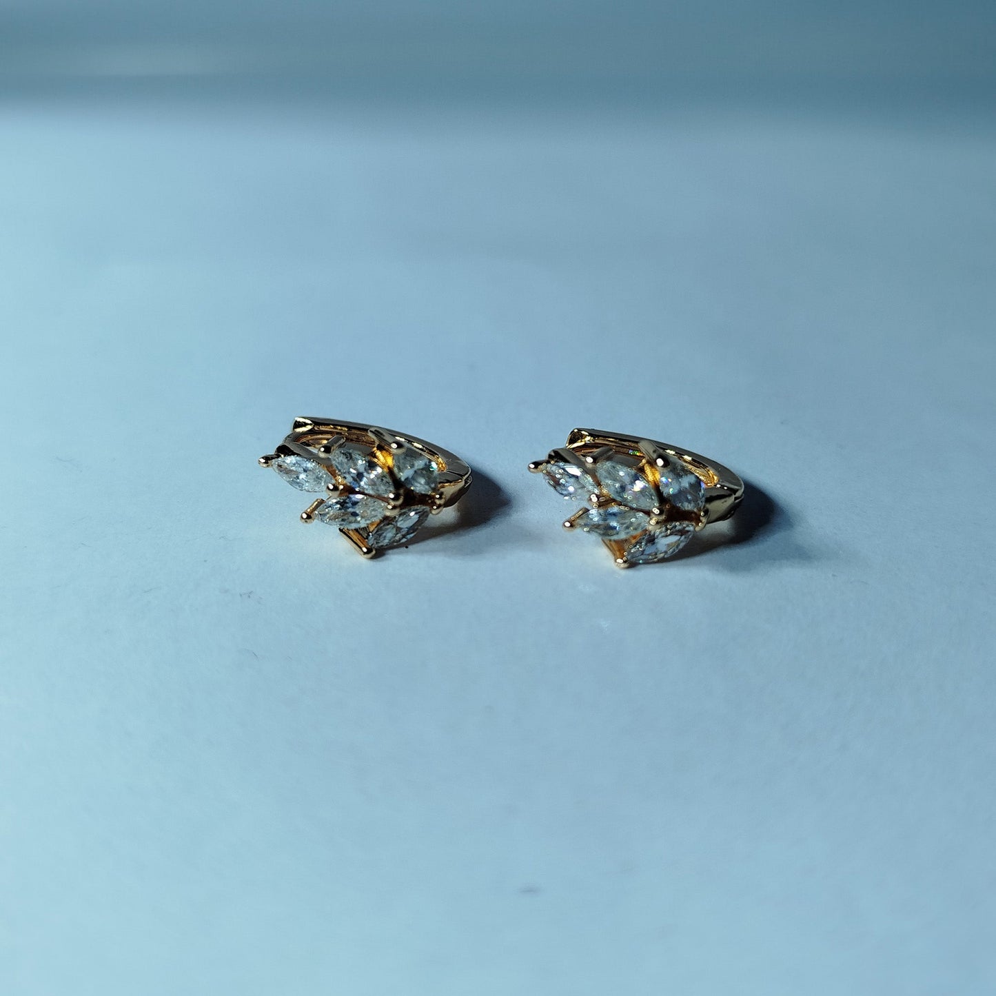 Crafted with meticulous gold-plated and white diamond earrings